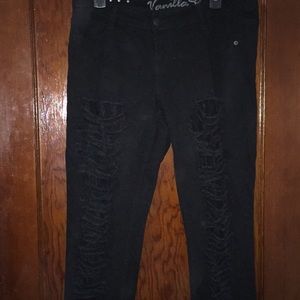 Distressed black skinny jeans